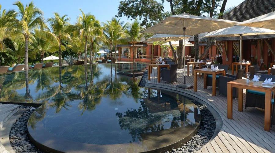 side view of pool and dining area